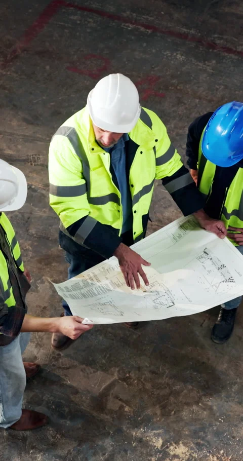 Above, engineer and team in building with blueprint, collaboration and advice Stock Footage 340604880