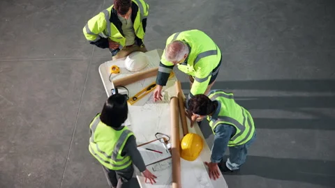 Above, engineer and team with document for construction, blueprint and sketch Stock Footage 341551524