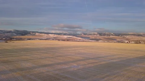 Above the fields with mountains in the background Stock Footage 166575231