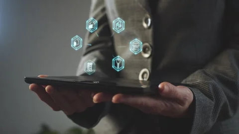 Above the graphics tablet held by the business lady there are hexagons Stock Footage 269146135