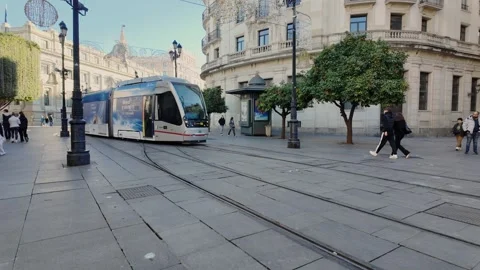 Above-ground light rail tram on Avenida de la Constitución Stock Footage 296295818