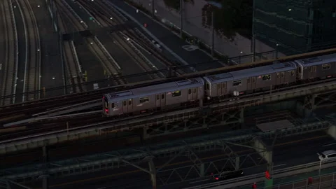 Above ground subway passing through Queens Stock Footage 254116398