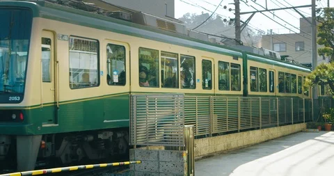 Above Ground Train Passing by in the City of Kamakura, Japan Stock Footage 125713257