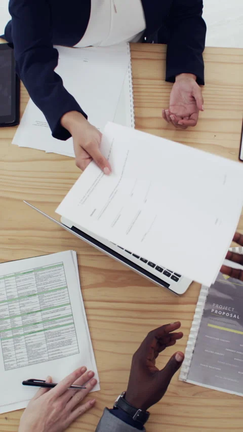 Above, hands and documents in office with laptop, project planning and data Stock Footage 329829908