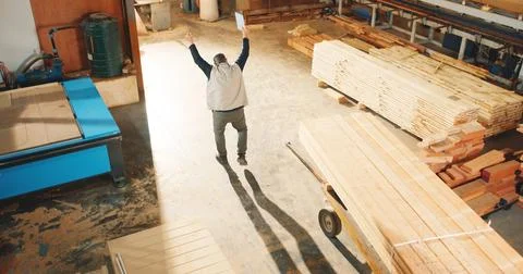 Above, man and dancing in workshop for carpentry, good news and celebration of Stock Photos