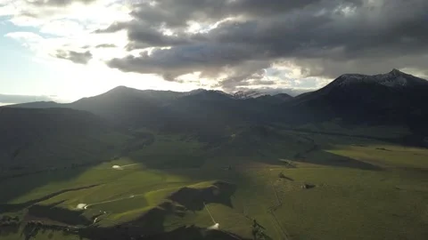 Above mountains and dramatic clouds Stock Footage 166331456