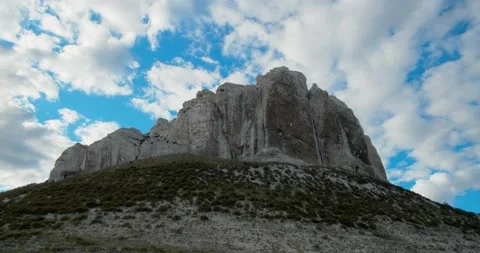 Above the old chalk cliff, clouds float in the blue sky. Stock Footage 131114091