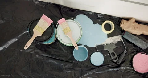 Above, paint and tools for renovation in home, empty or interior design with Stock Footage 336703267
