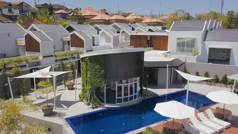 Above the pool in the middle of the new housing aerial footage Stock Footage 100635970