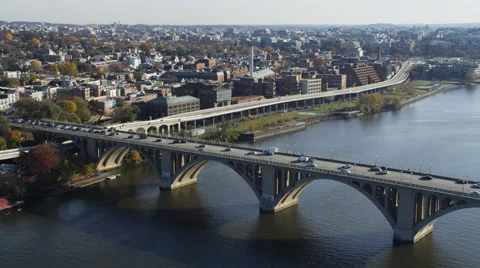 Above the Potomac, crossing Key Bridge looking east over Georgetown and Stock Footage 59198518