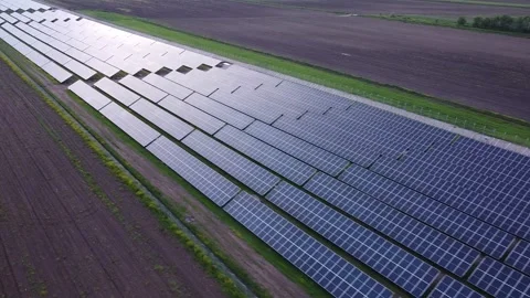 Above the Rays: Drone Views of Sunlit Solar Panel Field in Full Glory Video stock 255524772