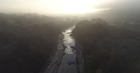 Above a river in a misty valley Stock Footage 156144867
