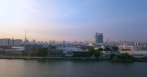 Above river under clear blue sky in sunrise panning right with panoramic view Stock Footage 108573942
