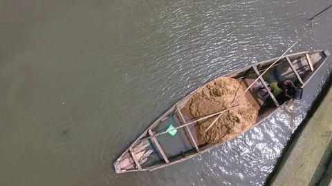 Above a sand transporter swimming between two pirogues Stock Footage 80938587