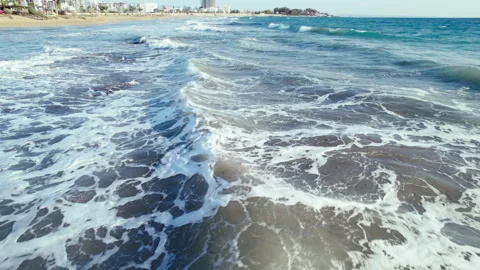 Above the sea surface, public beach shoreline Stock Footage 304674436