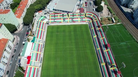 From above a seagull flying over the stadium of Clube Futebol Estrela Stock Footage 251626033