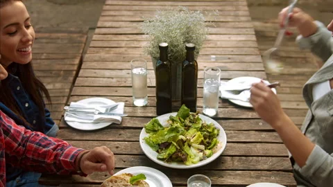 Above shot of healthy multicultural group of young people tossing the salad befo Video stock 199635239