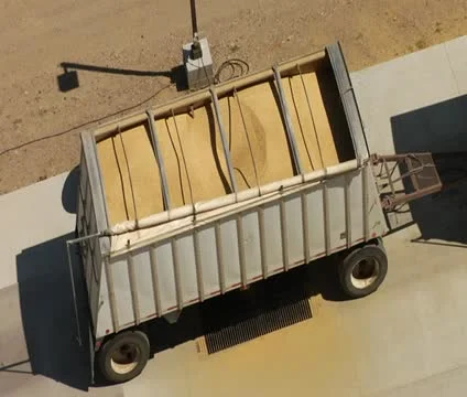 Above shot of semitruck offloading wheat Stock Footage
