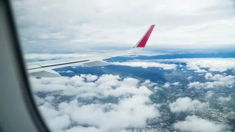 Above sky view of airplane from right wing - 4k Stock Footage 295235204