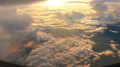 Above sky on warm sunset view from window seat airplane Stock Footage 221213939