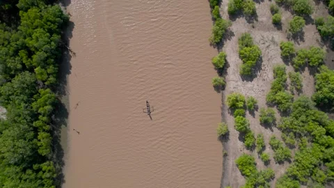 Above small boat on river Stock Footage 264753157