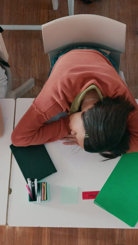 Above, students and sleeping in classroom with fatigue, difficult assessment and Stock Footage 332893805