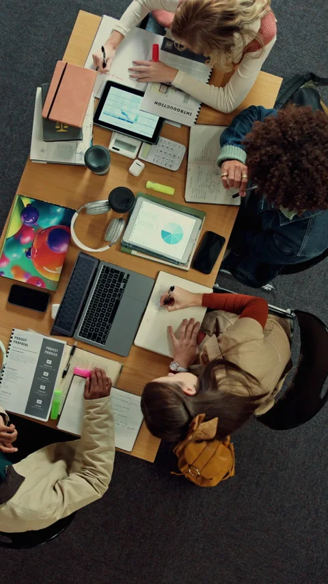 Above, students and tech in library with college assignment, writing and study Stock Footage 335806026