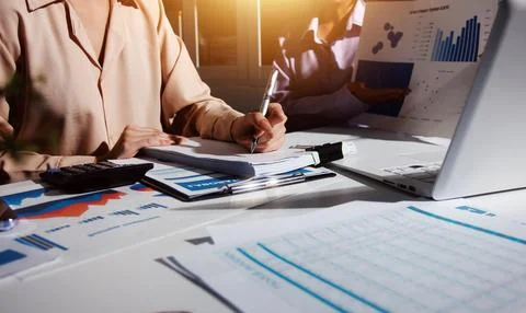Above table with finance papers, graphs and big data during teamwork meetin.. Stock Photos