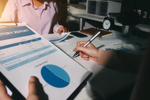 Above table with finance papers, graphs and big data during teamwork meetin.. Stock Photos