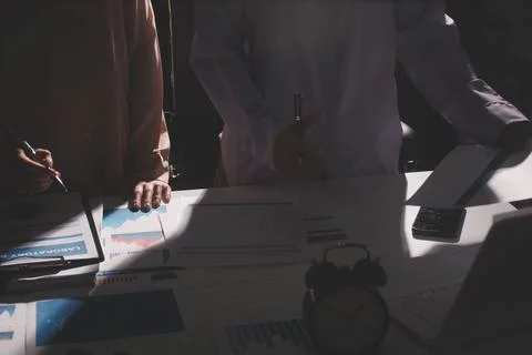 Above table with finance papers, graphs and big data during teamwork meetin.. Stock Photos