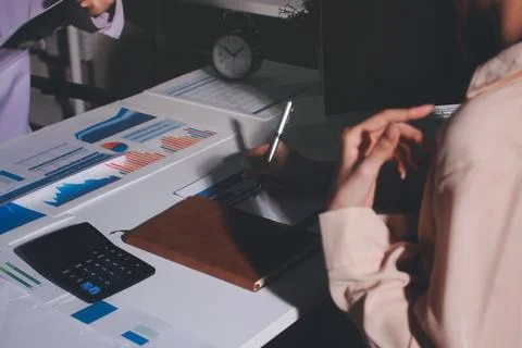 Above table with finance papers, graphs and big data during teamwork meetin.. Stock Photos