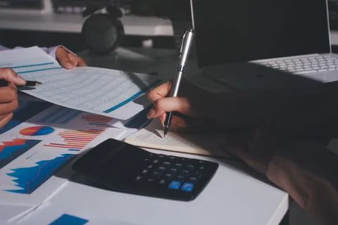 Above table with finance papers, graphs and big data during teamwork meetin.. Stock Photos