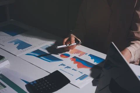 Above table with finance papers, graphs and big data during teamwork meetin.. Stock Photos
