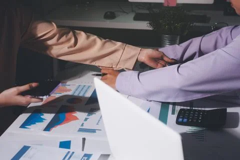 Above table with finance papers, graphs and big data during teamwork meetin.. Stock Photos