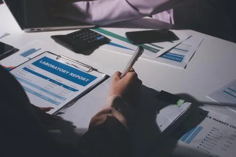 Above table with finance papers, graphs and big data during teamwork meetin.. Stock Photos