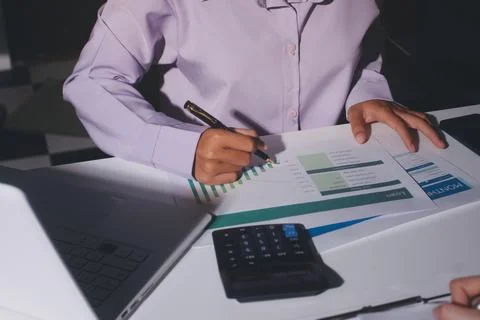 Above table with finance papers, graphs and big data during teamwork meetin.. Stock Photos