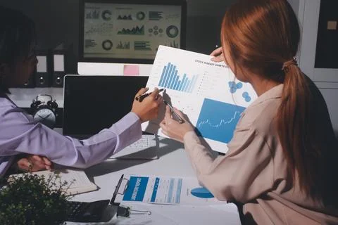 Above table with finance papers, graphs and big data during teamwork meetin.. Stock Photos