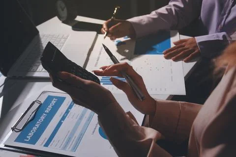 Above table with finance papers, graphs and big data during teamwork meetin.. Stock Photos