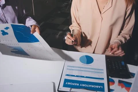 Above table with finance papers, graphs and big data during teamwork meetin.. Stock Photos