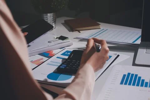 Above table with finance papers, graphs and big data during teamwork meetin.. Stock Photos