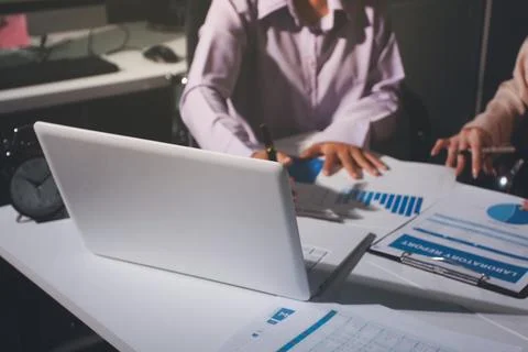 Above table with finance papers, graphs and big data during teamwork meetin.. Stock Photos