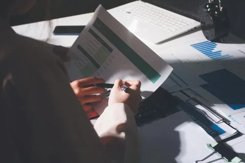 Above table with finance papers, graphs and big data during teamwork meetin.. Stock Photos