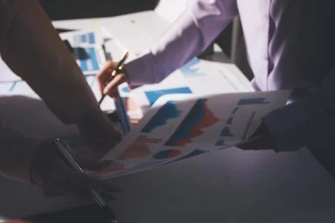 Above table with finance papers, graphs and big data during teamwork meetin.. Stock Photos