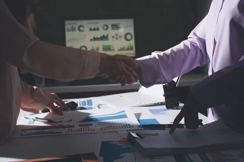 Above table with finance papers, graphs and big data during teamwork meetin.. Stock Photos