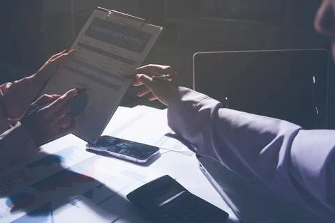Above table with finance papers, graphs and big data during teamwork meetin.. Stock Photos