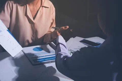 Above table with finance papers, graphs and big data during teamwork meetin.. Stock Photos