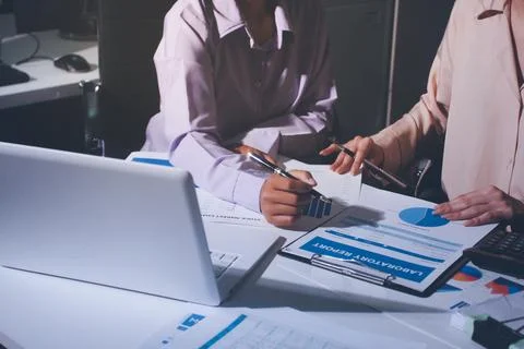 Above table with finance papers, graphs and big data during teamwork meetin.. Stock Photos