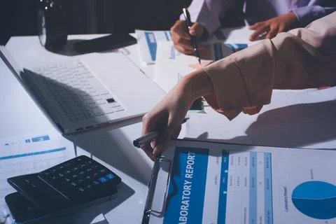 Above table with finance papers, graphs and big data during teamwork meetin.. Stock Photos