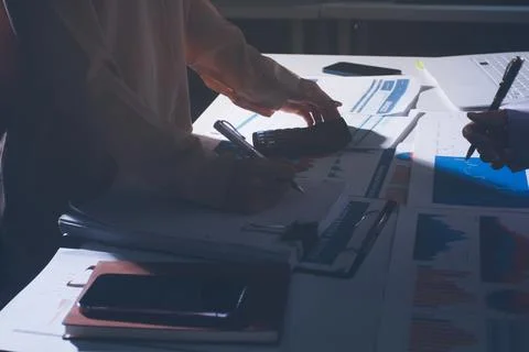 Above table with finance papers, graphs and big data during teamwork meetin.. Stock Photos