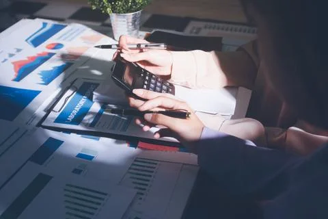 Above table with finance papers, graphs and big data during teamwork meetin.. Stock Photos